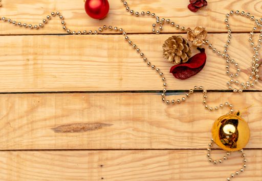 A top view of Christmas decorations on a wooden texture - perfect for background or wallpaper