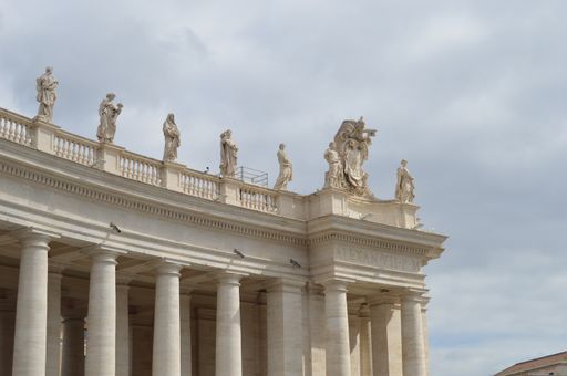 A low angle shot of statues of saints on the Cathedral at St. Peter's Square in Vatican