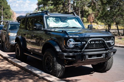 A Dark gray Ford Bronco SUV parked on the street