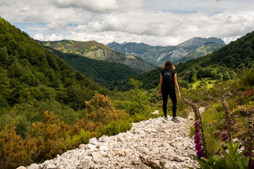 a Young woman admiring the highland views during a hike in Asturias