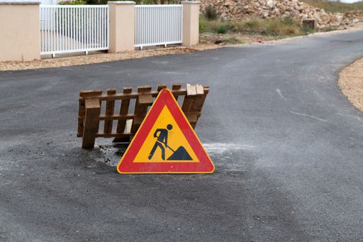A road sign pending reconstruction of a road