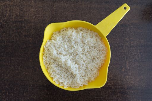 A top view of a yellow bowl with white rice