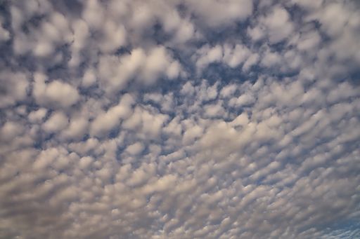 An amazing view of blue sky with fluffy clouds as a background