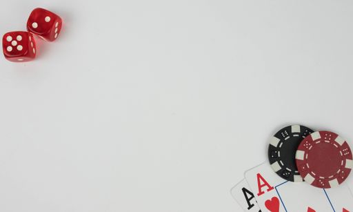 the ace playing cards, red dices with white dots and poker chips on a white background