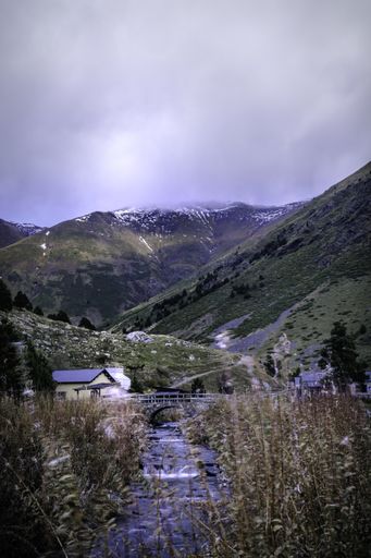 A vertical shot of Vall de Nuria in a fog day