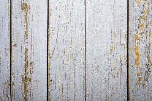A closeup shot of a white wooden surface with a space for text