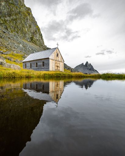 A beautiful shot of a small wooden church in Iceland, near Vestrahorn