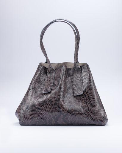 A vertical shot of a snake leather bag isolated on a gray background