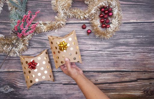 A flat lay of Christmas boxes on wooden background