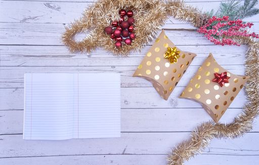 A flat lay of Christmas boxes on wooden background
