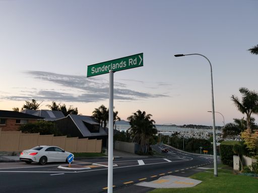 View of Sunderlands Rd white on green sign