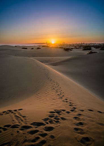 A vertical shot of the beautiful hills of Gran Canary during a pink sunset, Spain