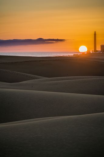 A vertical shot of the beautiful hills of Gran Canary during a pink sunset, Spain