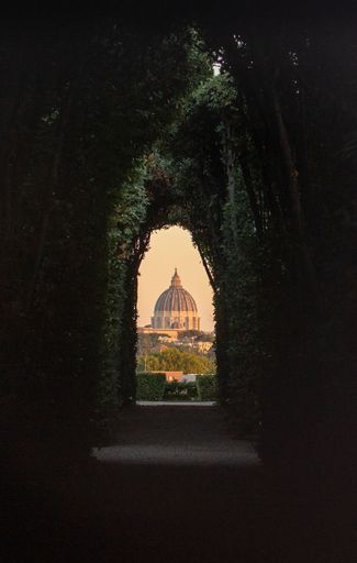 A beautiful view of the St. Peter's Basilica in Vatican City, through keyhole on the Aventine