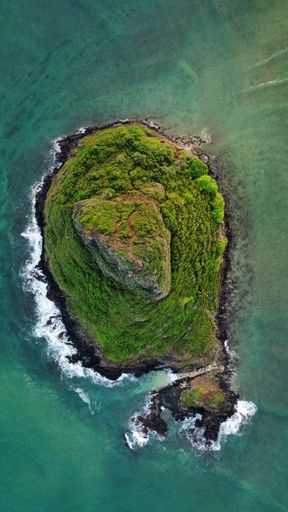 A drone shot of Chinaman's Hat islet in Hawaii