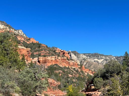 Mountains and red rock formations in Sedona against a blue sky on a sunny day