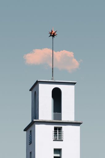 A vertical shot of a beautiful building under the blue sky captured in Copenhagen, Denmark