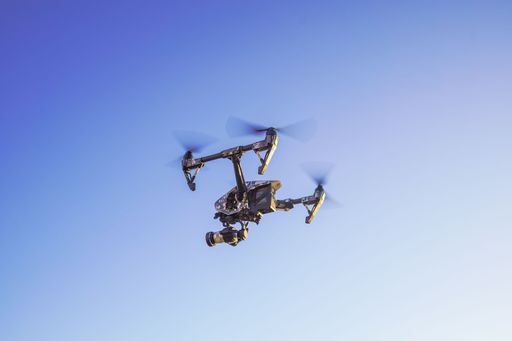 A low angle shot of a flying drone