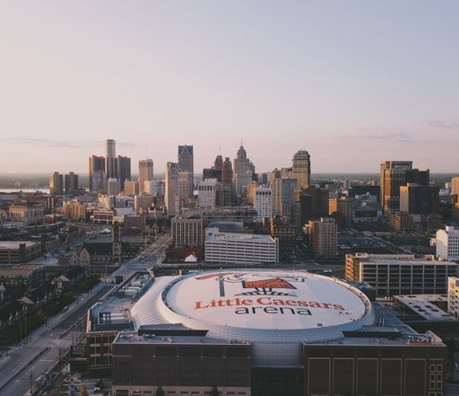 Sunrise drone shot of Detroit, MI. With views of newly completed Little Caesars Arena