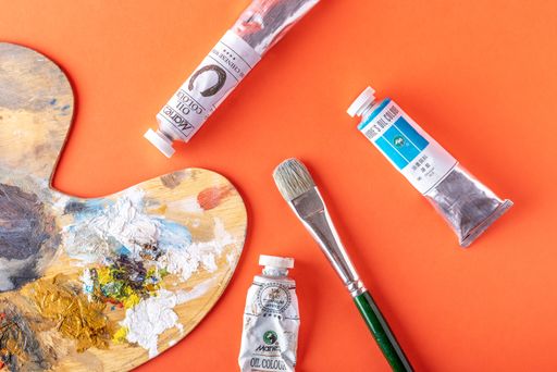 oil colors , ballet and brush on a colorful background