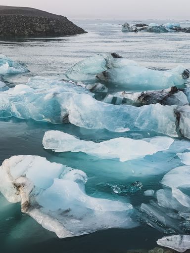 A vertical shot of a frozen shore of a lake in Iceland