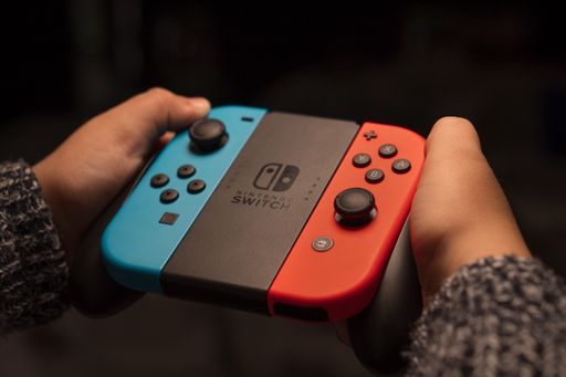 Santa Maria CV, Italy, October 17th 2020, The hands of a child playing a portable video game console