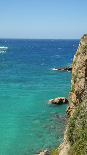 A vertical high angle shot of a beautiful beach in Crete, Greece captured during the daytime
