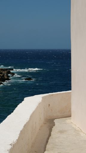 A vertical high angle shot of a beautiful beach in Crete, Greece captured from a balcony