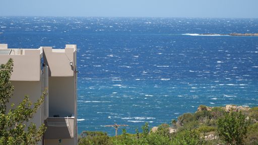 A high angle shot of a beautiful and clear sea captured from a building at the beach