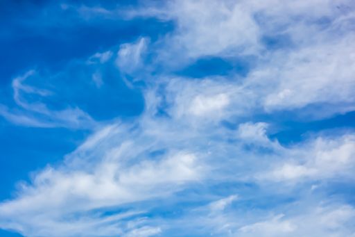 A low angle shot of the sky with clouds captured during the daytime