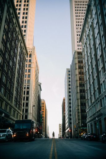 A vertical shot of a street between two buildings in downtown of Tulsa, Oklahoma, United States