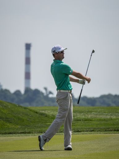Professional Golfer Zach Johnson photographed at the 2016 United States Open Golf Championship Tournament Twirling club after completing shot.
