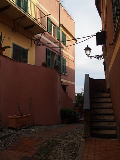 A vertical shot of  a street corner in an old European city