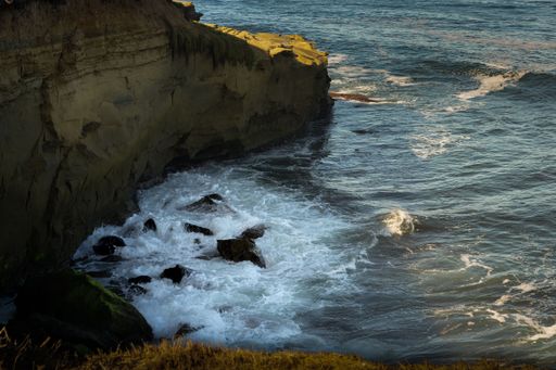 A scenic view of waves crashing on the rocks near La Jolla, San Diego