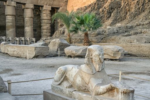 Stone sculptures in famous Karnak Temple Complex (Luxor, Egypt). Daylight and blue sky