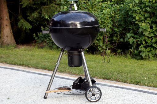 A closeup shot of ball grill for charcoal with lid