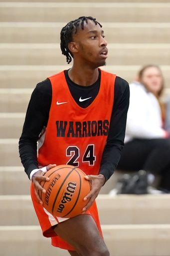 A vertical shot of young male players on the court at a fall Merrillville high school basketball game