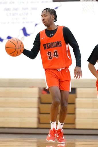 A vertical shot of young male players on the court at a fall Merrillville high school basketball game