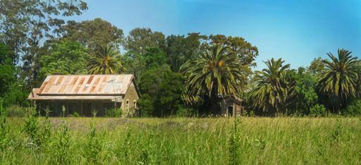 Panorama of the old abandoned railway station with its rusty zinc roof. Pipinas, Punta de Indio, Buenos Aires, Argentina