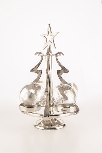 A vertical shot of ornaments on a small metallic Christmas tree isolated on a white background