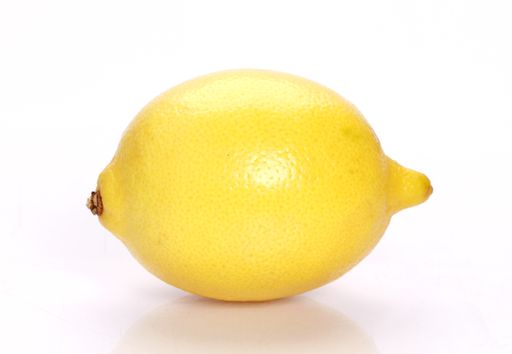 A single bright lemon isolated on a white background