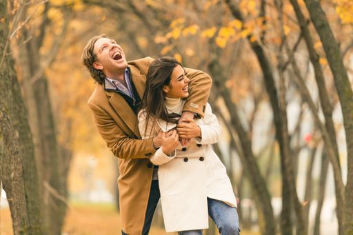 A shot of a young couple having fun in the park