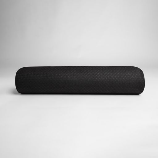A closeup of a black car pillow bolster isolated on a gray background