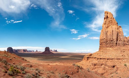 An aerial view of desert landscape with rock formations