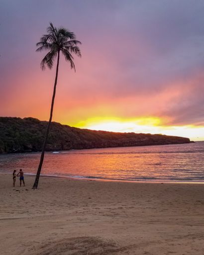 A vertical shot of a breathtaking sunset over the ocean at the tropical beach