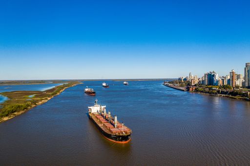 Aerial Shot over  Parana River looking in background Rosario City spring