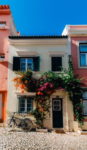 A vertical shot of a vintage house under blue sky in Cascais Portugal
