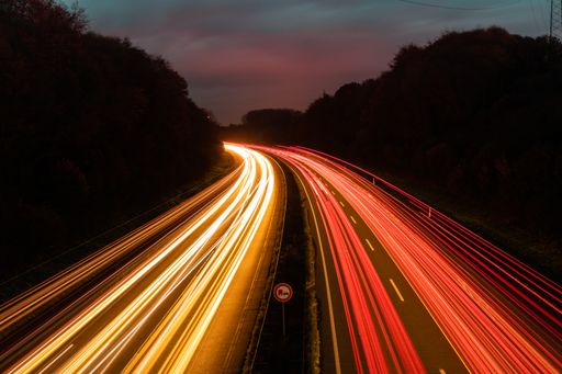 A beautiful and colorful long exposure of the driving cars on the highway at night