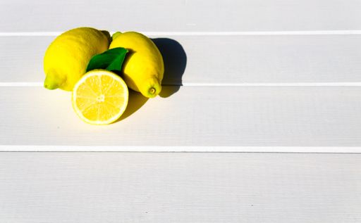 A top view of sliced lemons on a white table