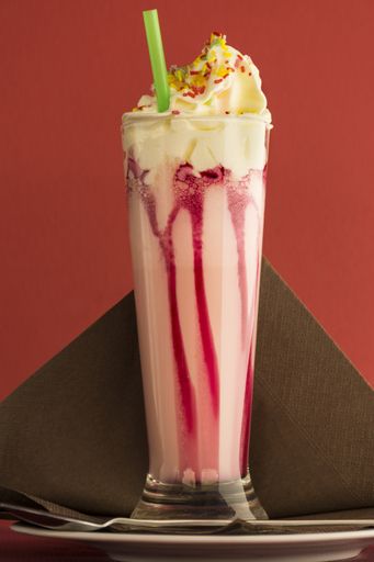 A vertical closeup shot of a delicious-looking milkshake
